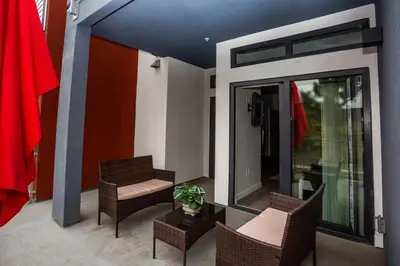 a balcony with two chairs and a table and a window at Studio with Large Balcony- San Diego Gateway in San Diego