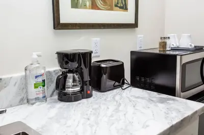 a kitchen counter with a coffee maker and a microwave at Explore San Diego-Balboa Park-Little Italy-Gaslamp in San Diego