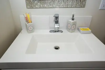 a white bathroom sink with a faucet on it at Explore San Diego-Balboa Park-Little Italy-Gaslamp in San Diego