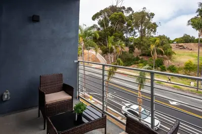 a balcony with a view of a highway at Explore San Diego-Balboa Park-Little Italy-Gaslamp in San Diego
