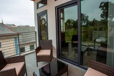 a balcony with chairs and a balcony with a view at Studio with Beautiful View next to Downtown in San Diego