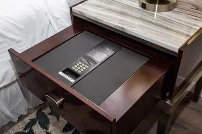 a wooden end table with a remote control on it at Modern, Luxurious and Prime location All in One in San Diego