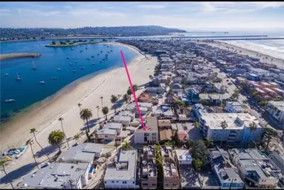an aerial view of a beach with a pink arrow at Highly rated Best Beach! AC Luxury KING Beds! in San Diego