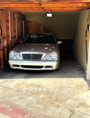 a silver car parked inside of a garage at Highly rated Best Beach! AC Luxury KING Beds! in San Diego