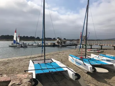 two boats sitting on the sand at a dock at Highly rated Best Beach! AC Luxury KING Beds! in San Diego
