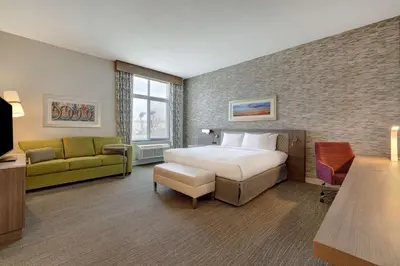 a hotel room with a bed and a couch at Hilton Garden Inn Temecula in Temecula