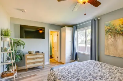 a bedroom with a bed and a ceiling fan at Modern Duplex Near Gaylord Resort and Bayfront! in Chula Vista
