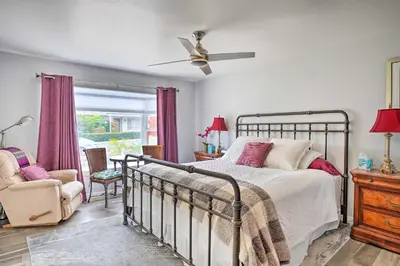 a bedroom with a bed and a chair and a window at San Marcos Home with Patio and Grill - Walk to Lake! in San Marcos