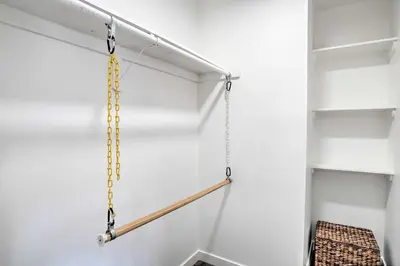 a hanging rail in a closet at San Marcos Home with Patio and Grill - Walk to Lake! in San Marcos