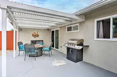 a patio with a table and chairs and a grill at San Marcos Home with Patio and Grill - Walk to Lake! in San Marcos
