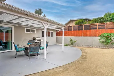a pergola on a patio with a table and chairs at San Marcos Home with Patio and Grill - Walk to Lake! in San Marcos
