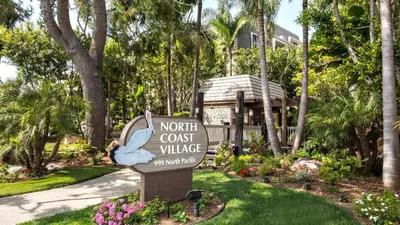 a sign in front of a resort with a rabbit at New Listing Ocean and Harbor View Cottage in Beach Resort in Oceanside