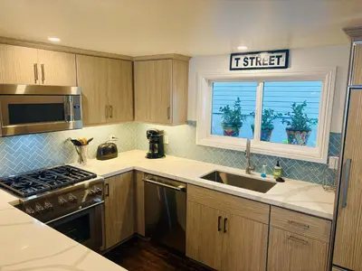a kitchen with a sink and a window at California Getaway in San Clemente