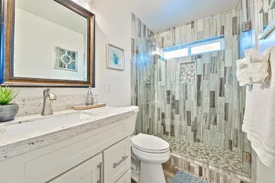 a bathroom with a sink and a toilet and a shower at New Tremont Modern Beach in Oceanside