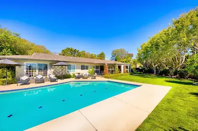a swimming pool in the yard of a house at La Jolla Scenic Retreat in San Diego
