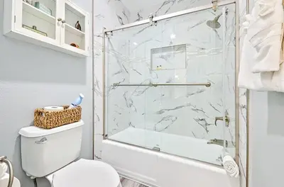 a bathroom with a shower and a toilet at Pier View Retreat in Oceanside
