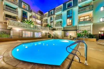 a large swimming pool in the middle of a building at Pier View Retreat in Oceanside