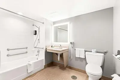 a bathroom with a toilet and a sink at Best Western Yacht Harbor Hotel in San Diego