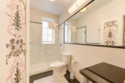a bathroom with a toilet and a shower at Inn at the Park in San Diego
