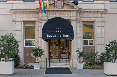 an entrance to a building with a black awning at Inn at the Park in San Diego