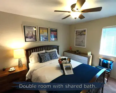 a bedroom with a double room with shared bath at Sommer Hus-Best value in Southern California Wine Country in Temecula