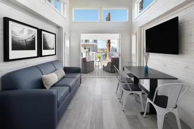 a living room with a couch and a table at Sun Outdoors San Diego Bay in Chula Vista