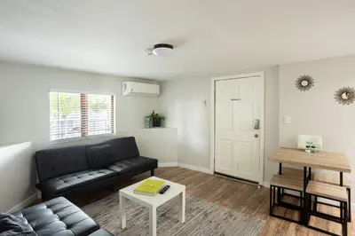 a living room with a couch and a table at Spacious Guest Suite Amazing Location in San Diego