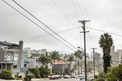 a city street with palm trees and buildings at Big Studio with Ocean View max 6 sleepers in San Diego