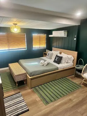 a bedroom with a large bed in a room at COZY Studio in Downtown San Diego in San Diego