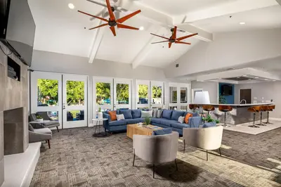 a large living room with blue couches and chairs at Huge Oceanside Private 2BR Apartment-Pool-Gym-Spa in Oceanside