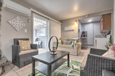 a living room with a couch and a table at Relaxing Poway Apt with Patio Near Parks and Wineries! in Poway
