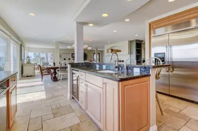 a kitchen with a large island with a sink at The Bridge At South Oceanside is the Perfect Family Beach House now with AC in Oceanside