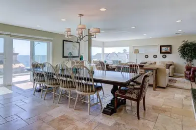 a dining room with a table and chairs at The Bridge At South Oceanside is the Perfect Family Beach House now with AC in Oceanside