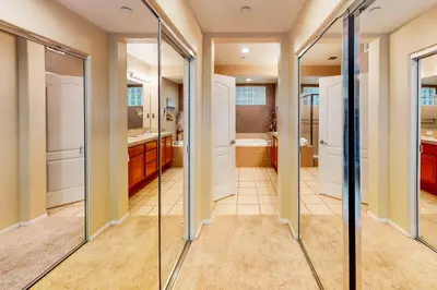 a bathroom with a walk in shower and glass doors at Ocean Pointe Lagoon 107 - 30 Night Minimum in Carlsbad