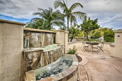 a patio with a water feature on the side of a house at Torrey Spa Suite Modern San Diego Studio! in San Diego