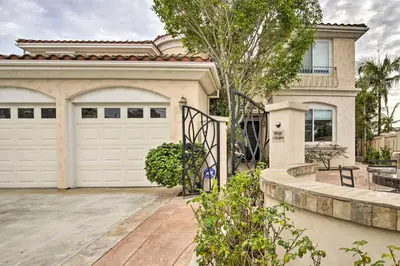 a house with a white garage door and a driveway at Torrey Spa Suite Modern San Diego Studio! in San Diego
