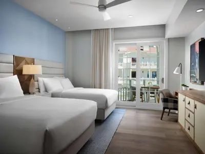 a hotel room with two beds and a balcony at Shore House at The Del, LXR Hotels & Resorts in San Diego