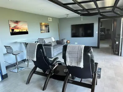 a living room with two chairs and a couch at Contemporary Ocean Sunset Views with Firepit Pt Loma close to PLNU in San Diego