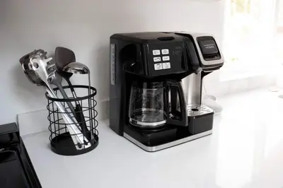 a black coffee maker sitting on a counter at Coastal, Elegant, Modern, King Bed in San Diego