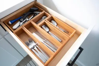 a wooden drawer with utensils in a kitchen at Coastal, Elegant, Modern, King Bed in San Diego