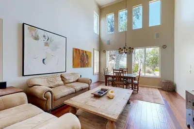 a living room with a couch and a table at Torrey Treats House in San Diego