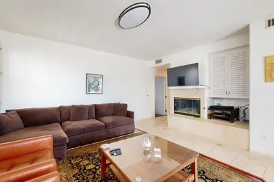 a living room with a couch and a table at Torrey Treats House in San Diego