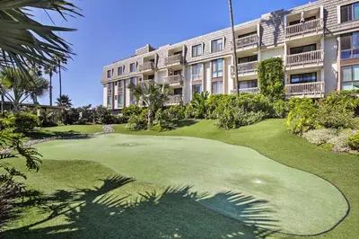 a golf course in front of a building at Stunning Oceanside Condo Walk to the Beach! in Oceanside