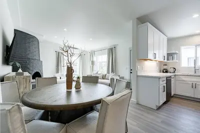 a kitchen and dining room with a table and chairs at The Rosemont II - La Jolla Luxury in San Diego