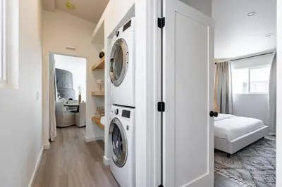 a laundry room with a washer and dryer at The Rosemont II - La Jolla Luxury in San Diego