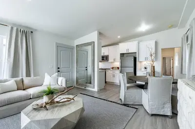 a living room with a couch and a table at The Rosemont II - La Jolla Luxury in San Diego