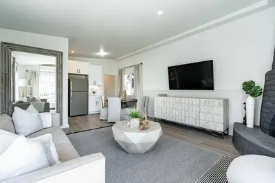 a living room with a couch and a table at The Rosemont II - La Jolla Luxury in San Diego