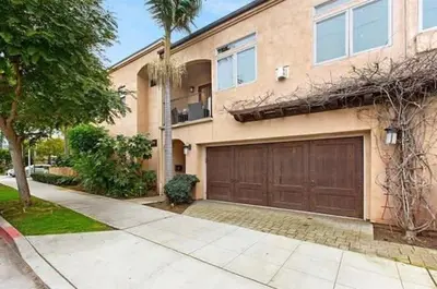 a house with a garage and a palm tree at The San Diego Studio - Free Parking in San Diego