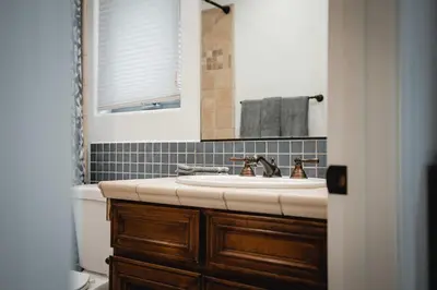 a bathroom with a sink and a mirror at The San Diego Studio - Free Parking in San Diego