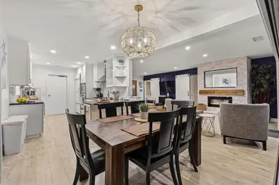a dining room and kitchen with a table and chairs at The California - On Top of San Diego in a Hot Tub in San Diego
